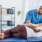 chiropractor-massaging-back-of-patient-that-lying-2023-11-27-05-15-24-utc-scaled